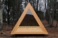 A frame cabin with large window