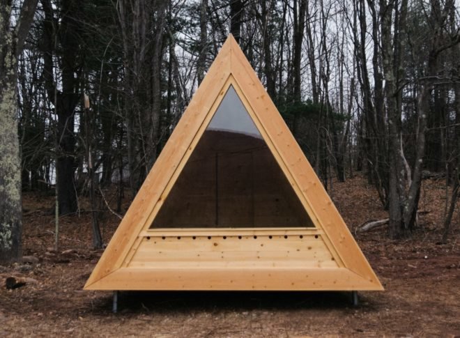 A frame cabin with large window