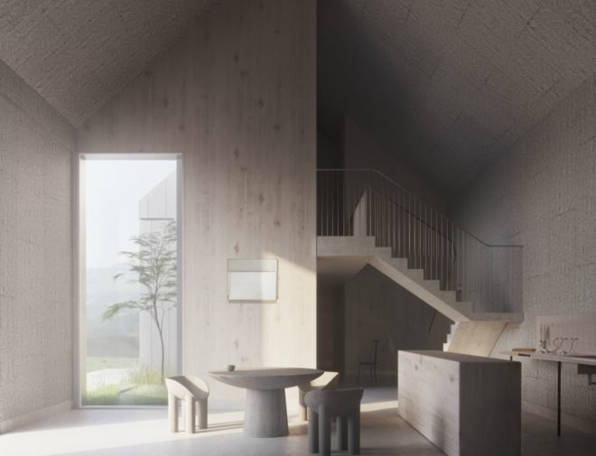 Interior of a prefab home with stone table, chairs, and staircase