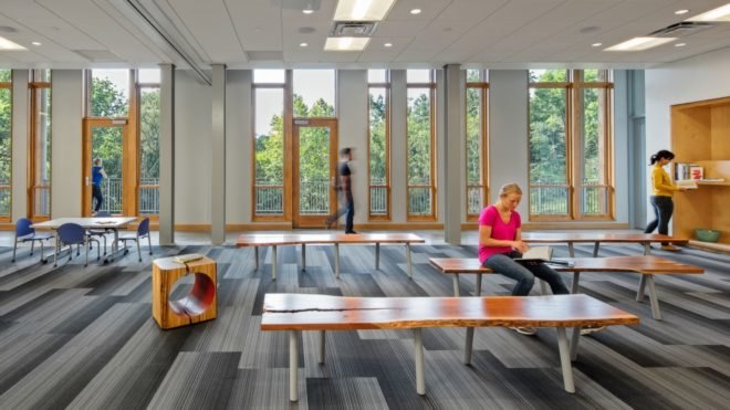 Classroom space with benches and tables