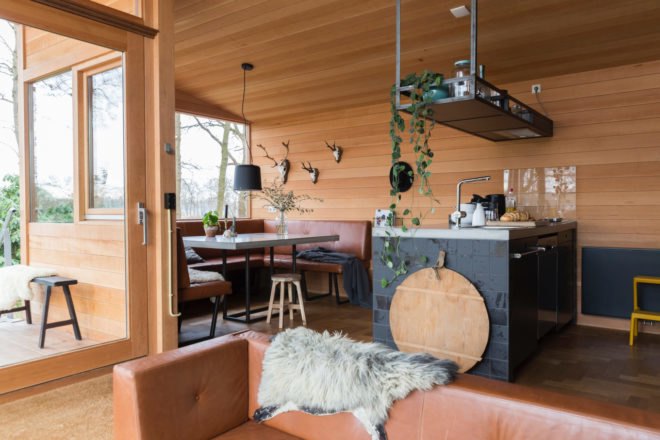 interior of cabin with sofa and dining area