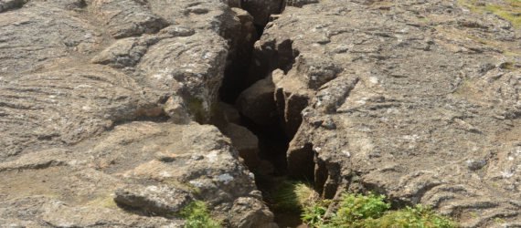 A close-up of a large fissure opening in the Earth