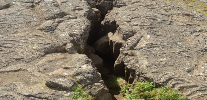 A close-up of a large fissure opening in the Earth