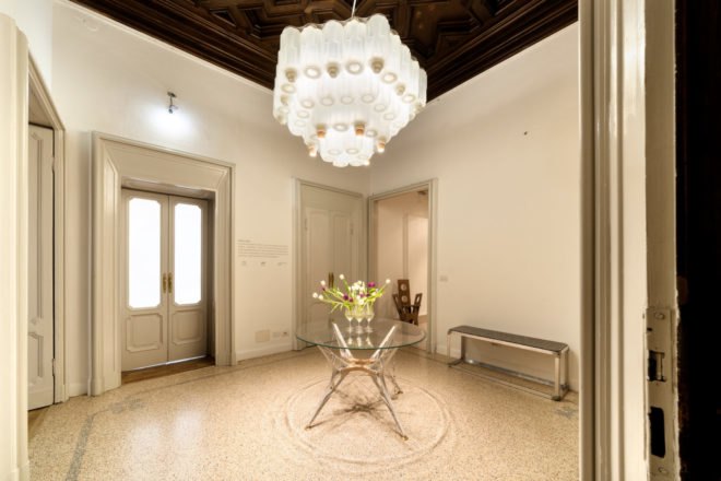 a spacious room with a large chandelier