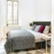 white room with a large bed