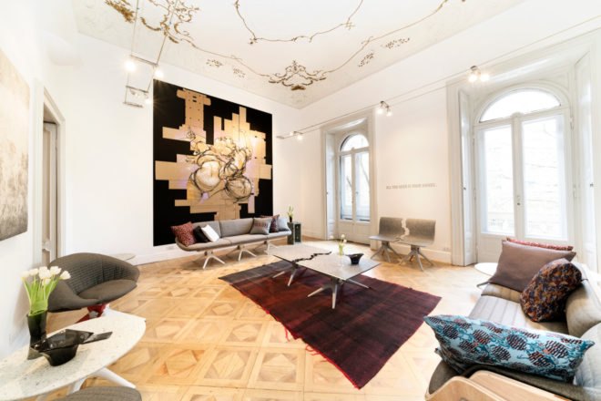 a living space with hardwood floors and furniture