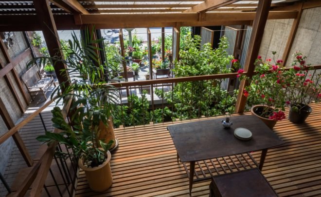 a table surrounded by greenery