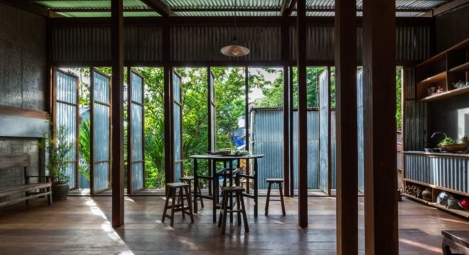 a dining table next to various open doors