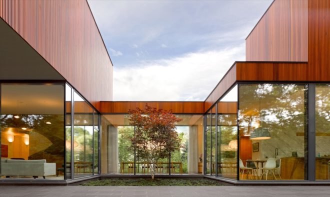 Floor to ceiling windows looking into the house