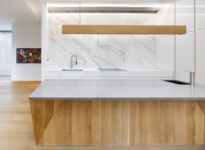A kitchen with white countertops