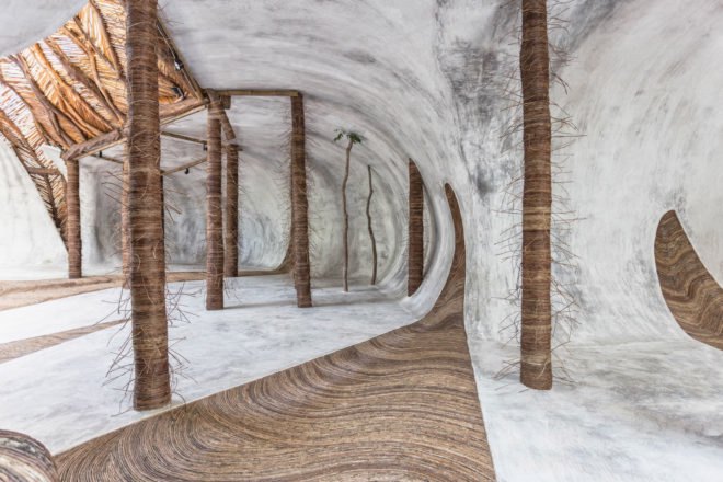 Wooden pillars supporting a curved ceiling