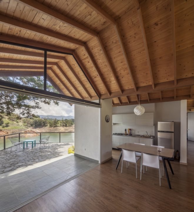 kitchen and dining room with tall timber ceilings