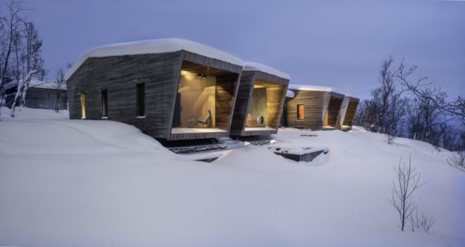 series of cabins covered in snow