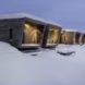 series of cabins covered in snow
