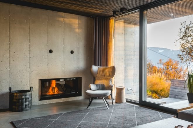 room with fireplace and chair