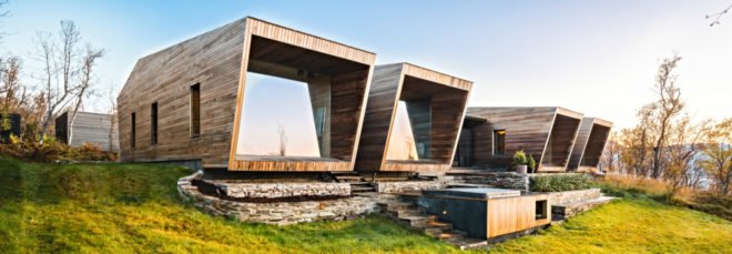 two large cabins with glazed facades