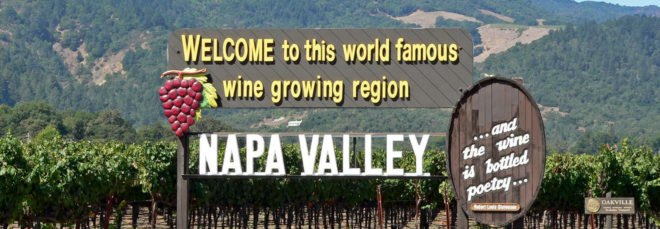 Napa Valley sign reads "Welcome to this world famous wine growing region: Napa Valley."