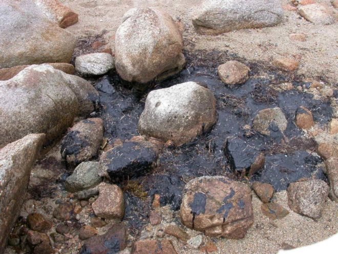 oil spill on rocks