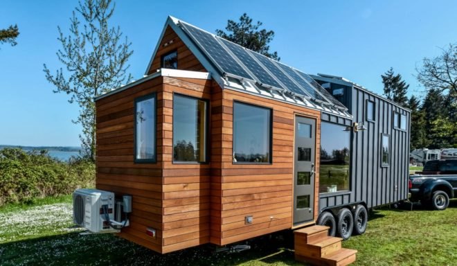 wooden tiny home with solar panels