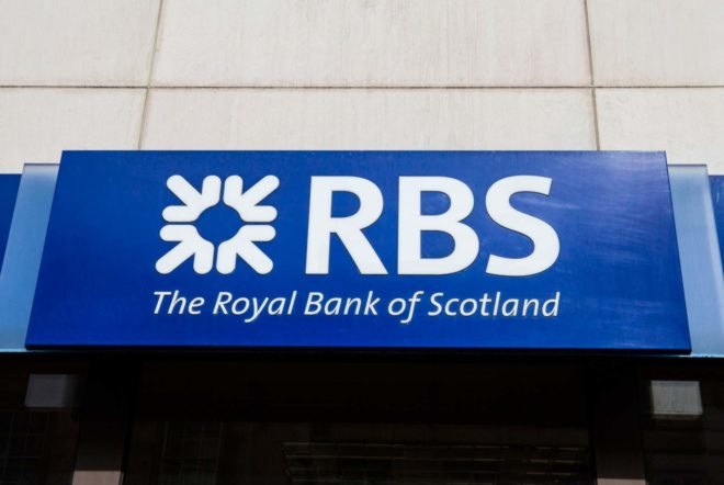 A sign with the logo and name of the Royal Bank of Scotland