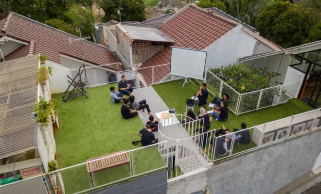 Aerial view of people hanging out on the roof