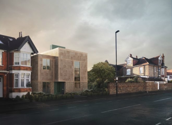 The exterior of a cube-shaped, prefab house with a stone facade