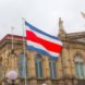 Flag of Costa Rica in front of the San Jose National Theater