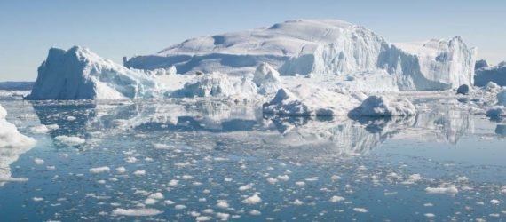 An iceberg and ice floes in the Arctic sea
