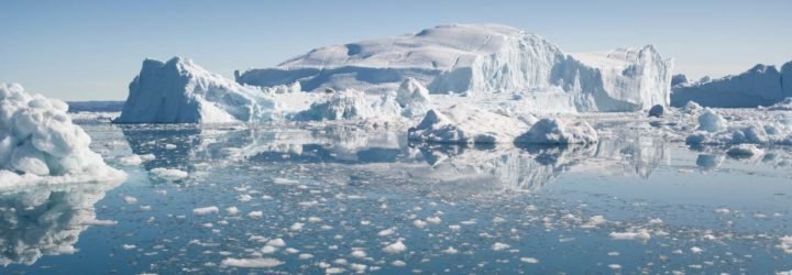 An iceberg and ice floes in the Arctic sea