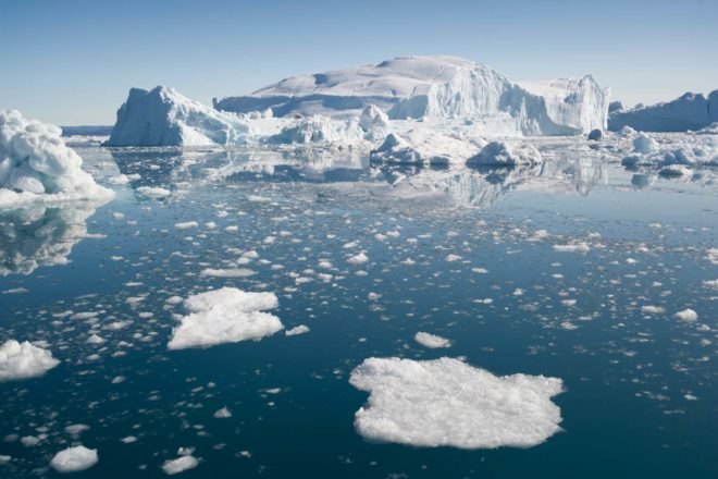An iceberg and ice floes in the Arctic sea