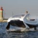 The original SeaBubble in St. Tropez with a lighthouse in the background