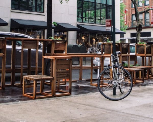 wooden seats and tables on a street