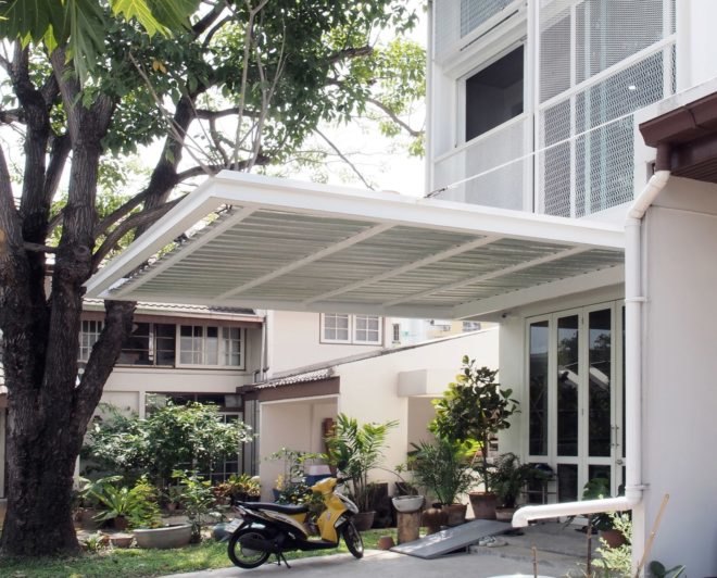 white awning over entrance to white building