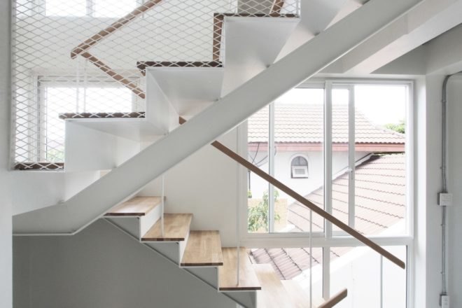 white stairwell in light-filled building