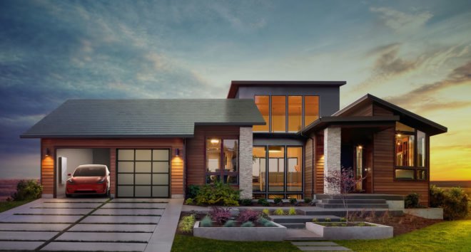 Home with a Tesla Model S in the garage and a Tesla solar roof