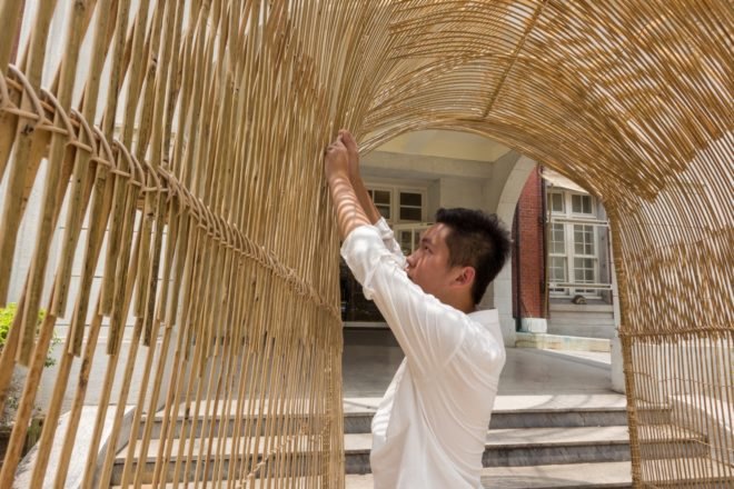 artist fixing the installation