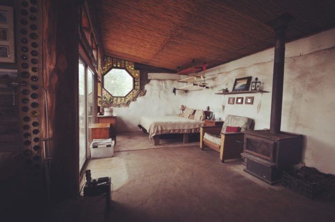 an interior space with a bedroom in the background