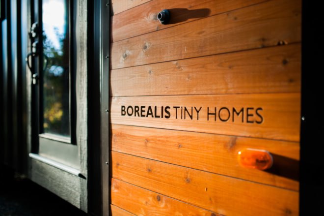 cedar planks with borealis tiny homes written on them