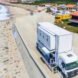 Truck Surf Hotel parked on the beach