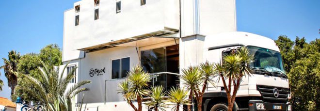 Truck Surf Hotel set up on the beach.
