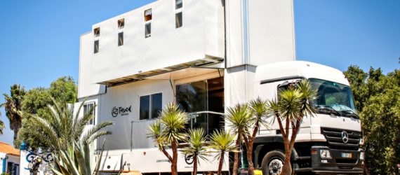 Truck Surf Hotel set up on the beach.