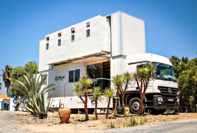 Truck Surf Hotel set up on the beach.