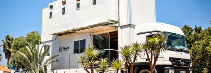 Truck Surf Hotel set up on the beach.