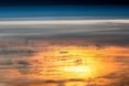 Sunlight pierces through a cloudy sky
