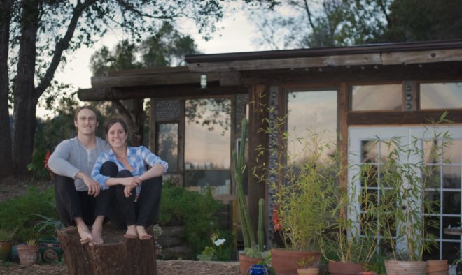 couple sitting outside a home