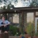 couple sitting outside a home