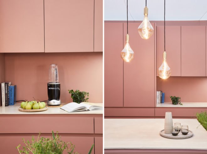 Rose colored kitchen with hanging lights
