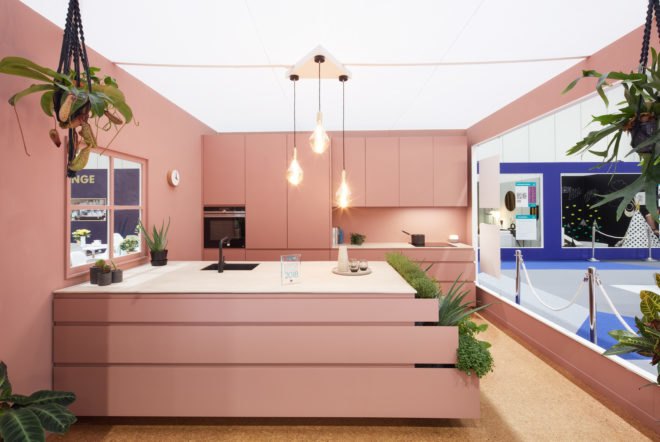 rose colored kitchen with green plants