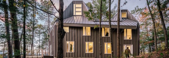 exterior view of modern gray lake house