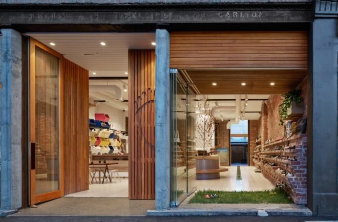 ground floor retail space with wooden paneling and green space